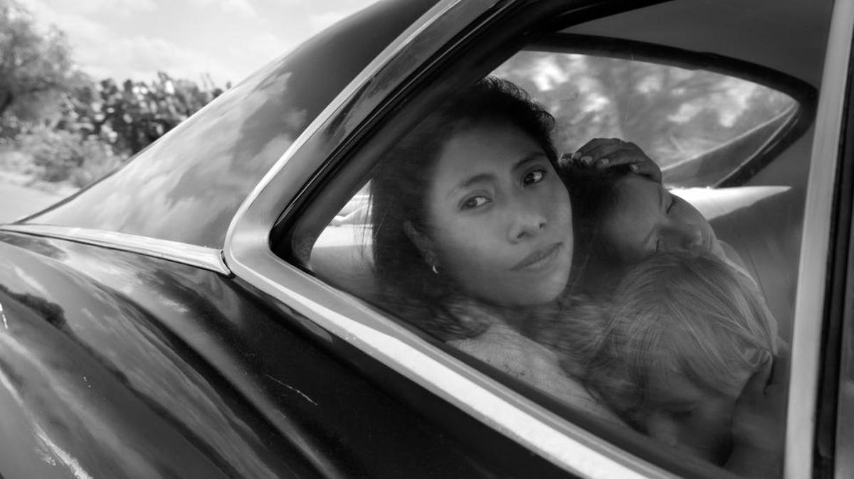 Yalitza Aparicio as Cleo, Marco Graf as Pepe, and Daniela Demesa as Sofi in Roma, written and directed by Alfonso Cuarón. Netflix has scored its first best-picture Oscar nomination for “Roma.”