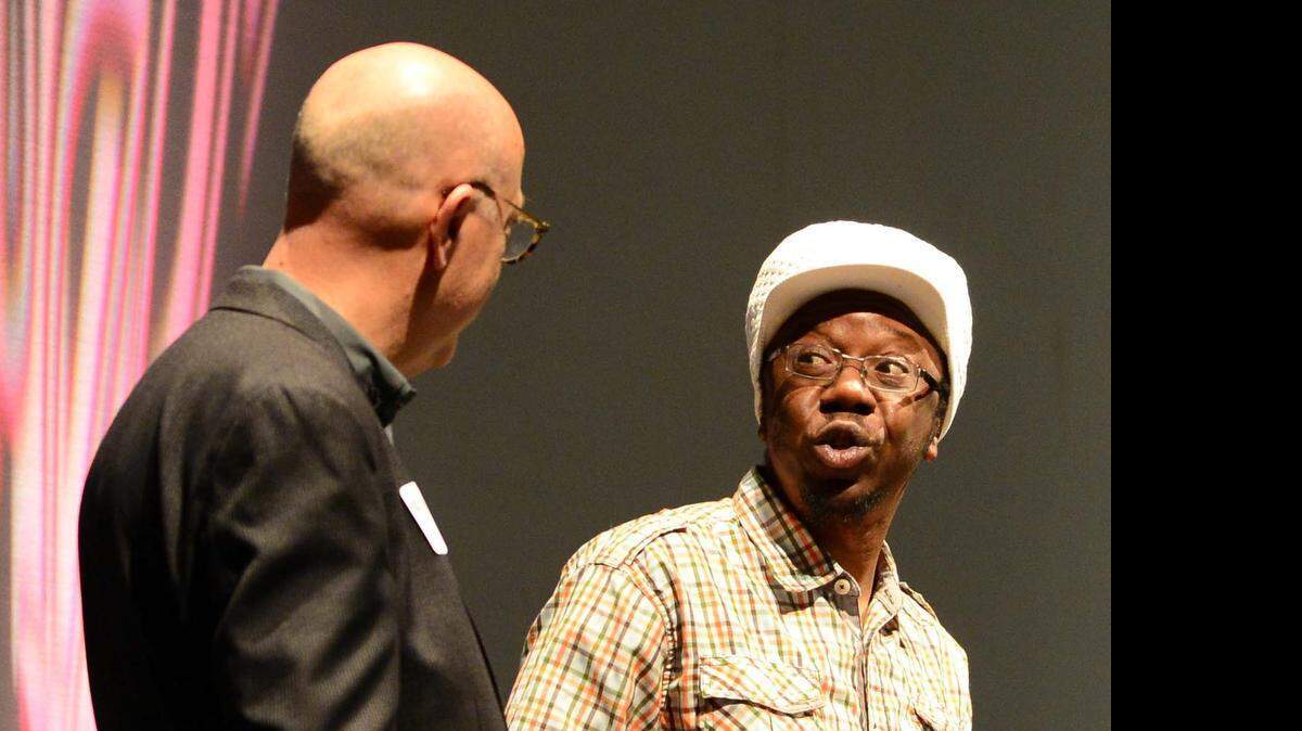 
Hip-hop artist Jonzi D, right, talks with Blumenthal Performing Arts President Tom Gabbard.
