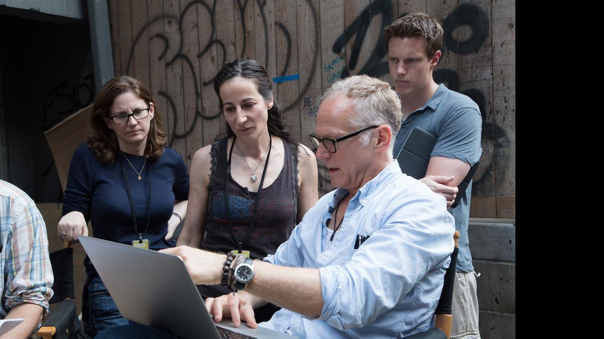 
Laeta Kalogridis (at center), executive producer and co-writer of “Terminator Genisys,” goes over the script on set with producers Dana Goldberg and David Ellison.
