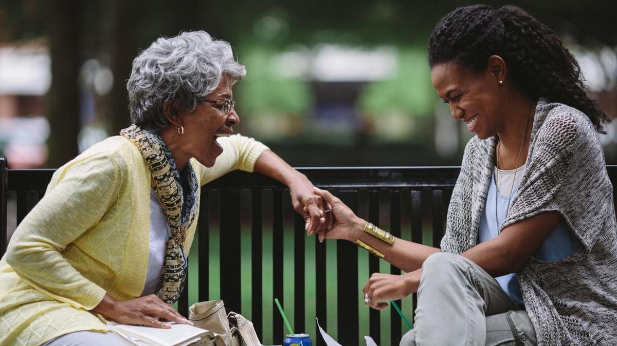 Karen Abercrombie, left, as Miss Clara celebrates as Priscilla Shirer as Elizabeth Jordan shares how God answered a specific prayer in a scene from the film, “War Room.”