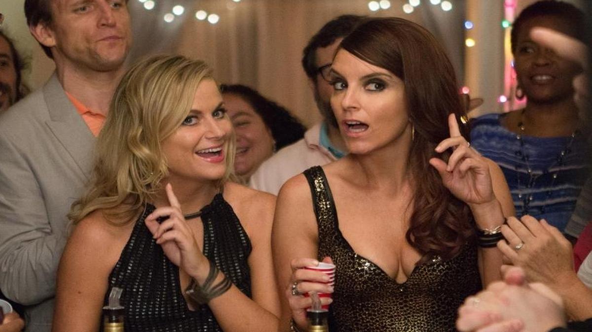 Amy Poehler, left, and Tina Fey appear in a scene from the film, “Sisters.”
