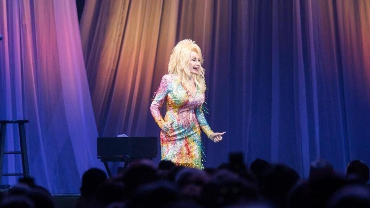 Dolly Parton performs as part of her “Pure & Simple Tour” at Charlotte’s Spectrum Center on Saturday night.