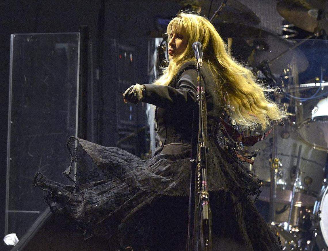 Stevie Nicks moves to the music of her band, Fleetwood Mac.