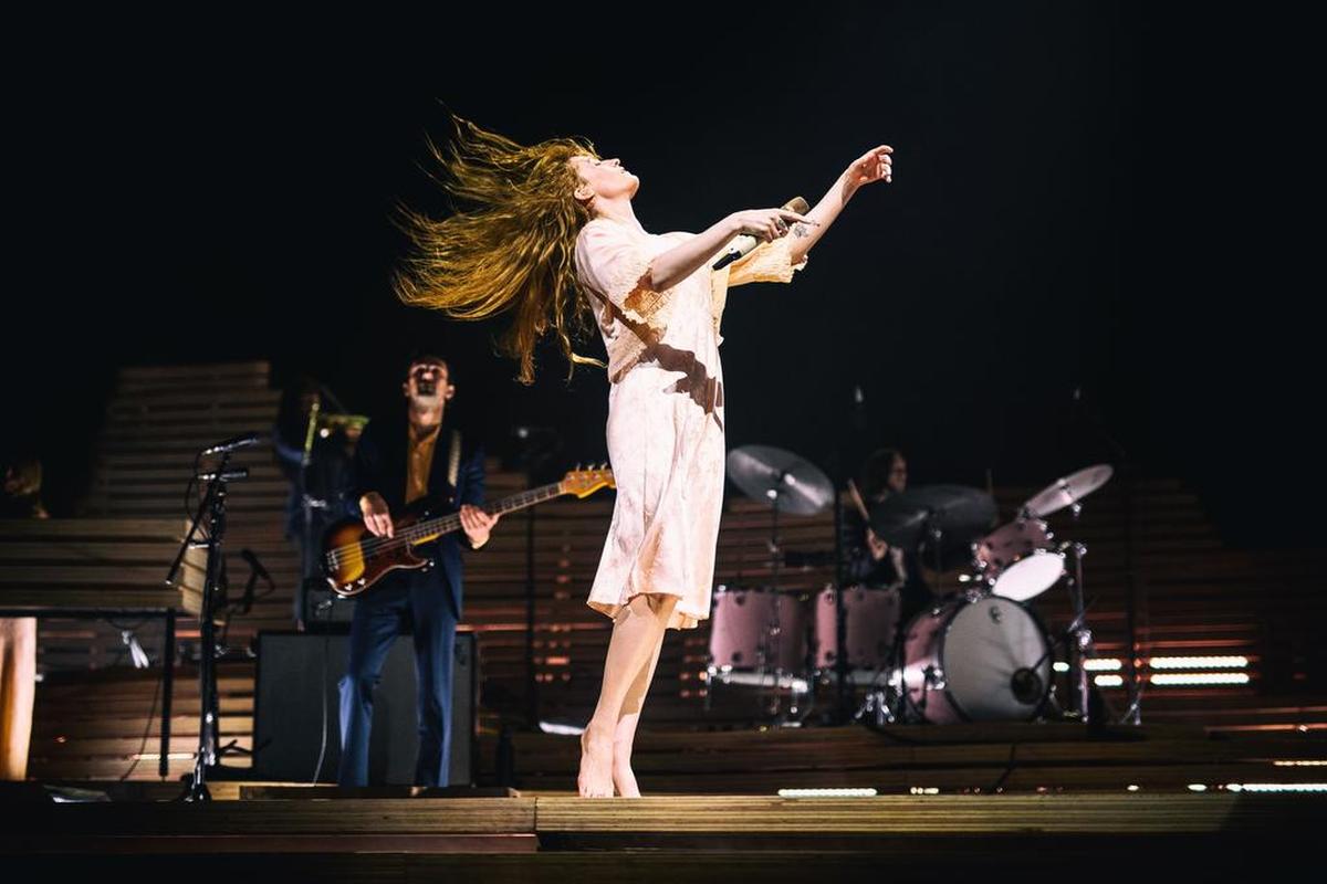 Florence Welch of Florence + the Machine spins through a song early in her set.
