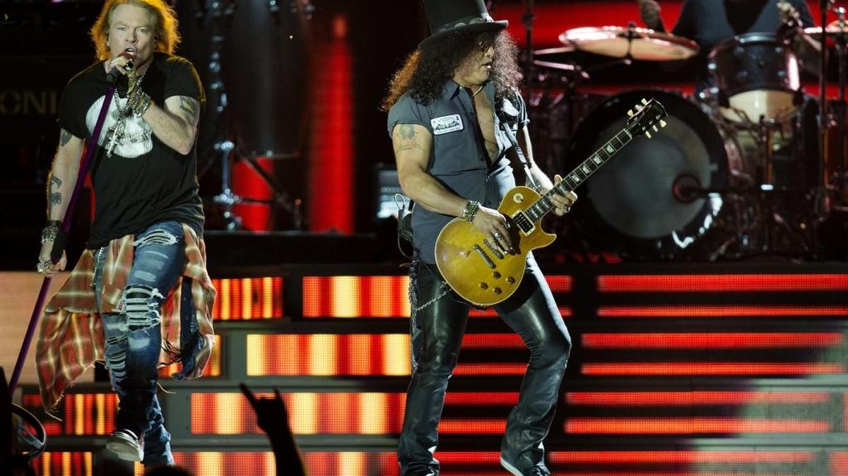 Guns N’ Roses lead vocalist, Axl Rose (left) and lead guitarist Slash (right) and drummer Frank Ferrer performed together for the crowd Wednesday, June 29, 2016 at Arrowhead Stadium.