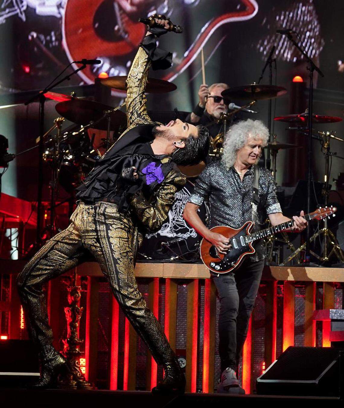 Singer Adam Lambert, left, drummer Roger Taylor, center and guitarist Brian May, right, perform during the Queen + Adam Lambert show at Spectrum Center in Charlotte, NC on Friday, August 23, 2019.