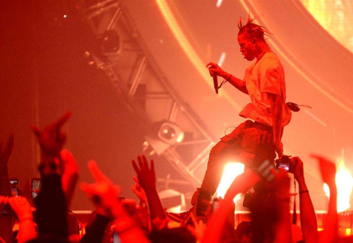 Travis Scott skips across the stage early in his Charlotte show.