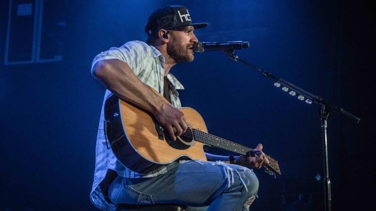 Chase Rice performs at a show in Myrtle Beach last weekend, just a few days after he had pectoral surgery.