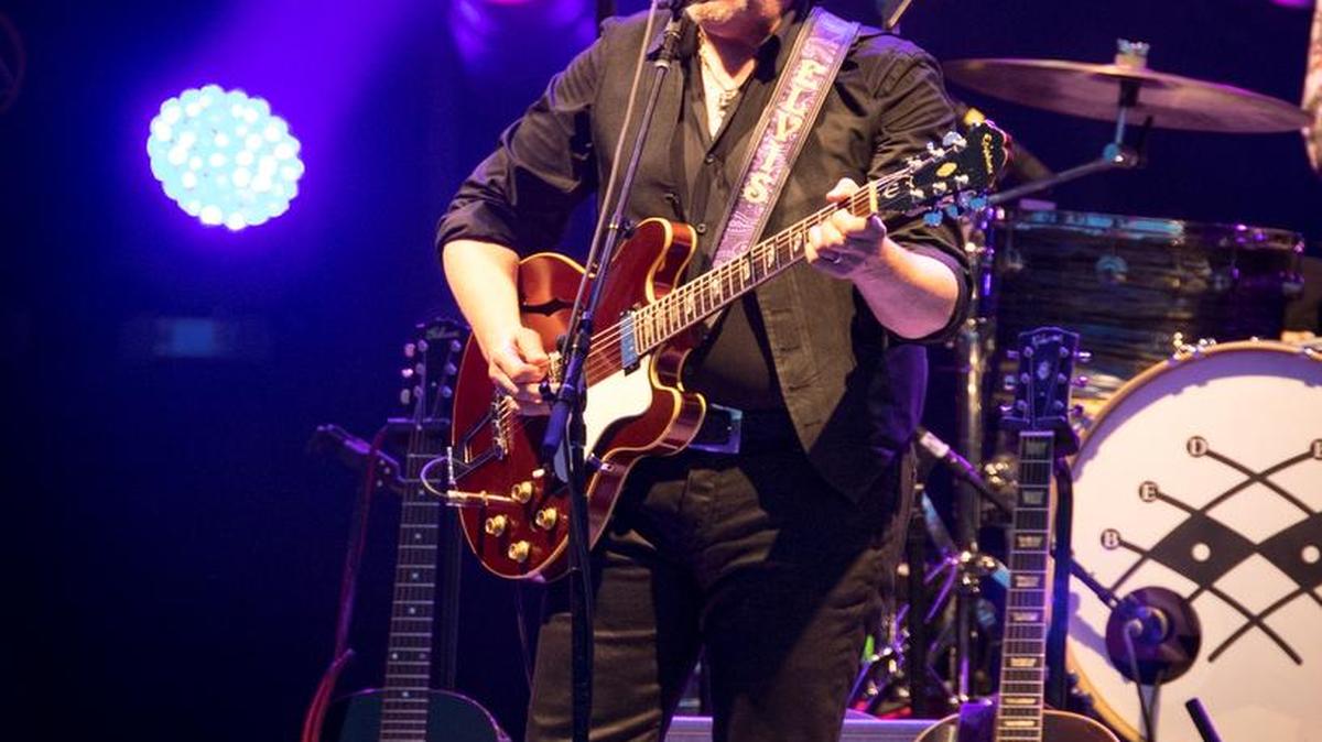Elvis Costello & the Imposters perform at Charlotte Metro Credit Union Amphitheatre on Wednesday night.
