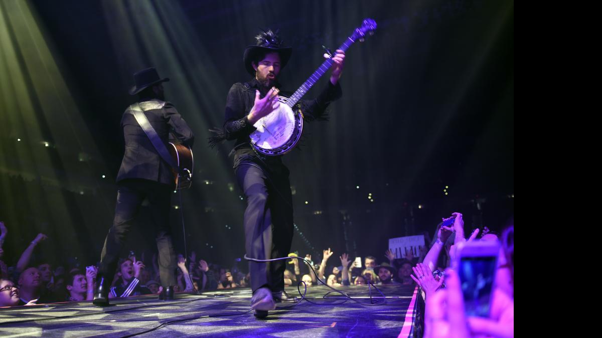
Scoctt (right) and Seth Avett (left) on stage at The Avett Brothers'New Year's Eve show at PNC Arena in Raleigh, NC. Dec. 31, 2014. 
