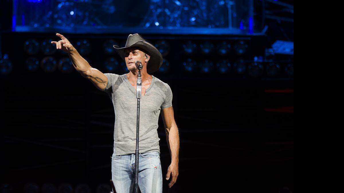 
Tim McGraw performs with Bill Currington and Chase Bryant on the Shotgun Rider Tour at PNC Music Pavilion on July 11, 2015. 
