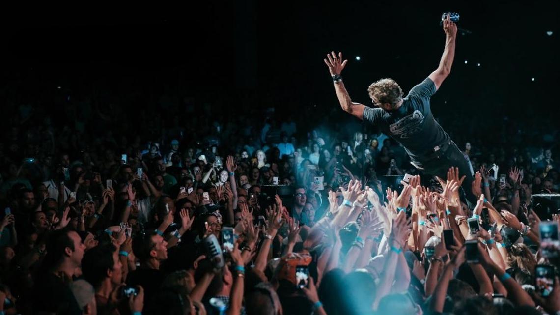Dierks Bentley posted this photo from his Charlotte concert, of him trust-falling/stage-diving into the pit at PNC Music Pavilion on Thursday night.