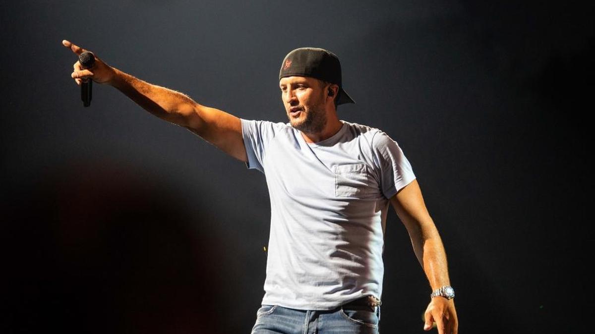 Luke Bryan points to the crowd at PNC Music Pavilion on Friday night.