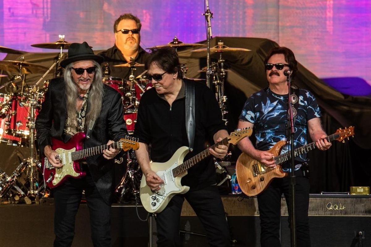 Patrick Simmons, John McFee and Tom Johnston of The Doobie Brothers at PNC Music Pavilion on Thursday night.