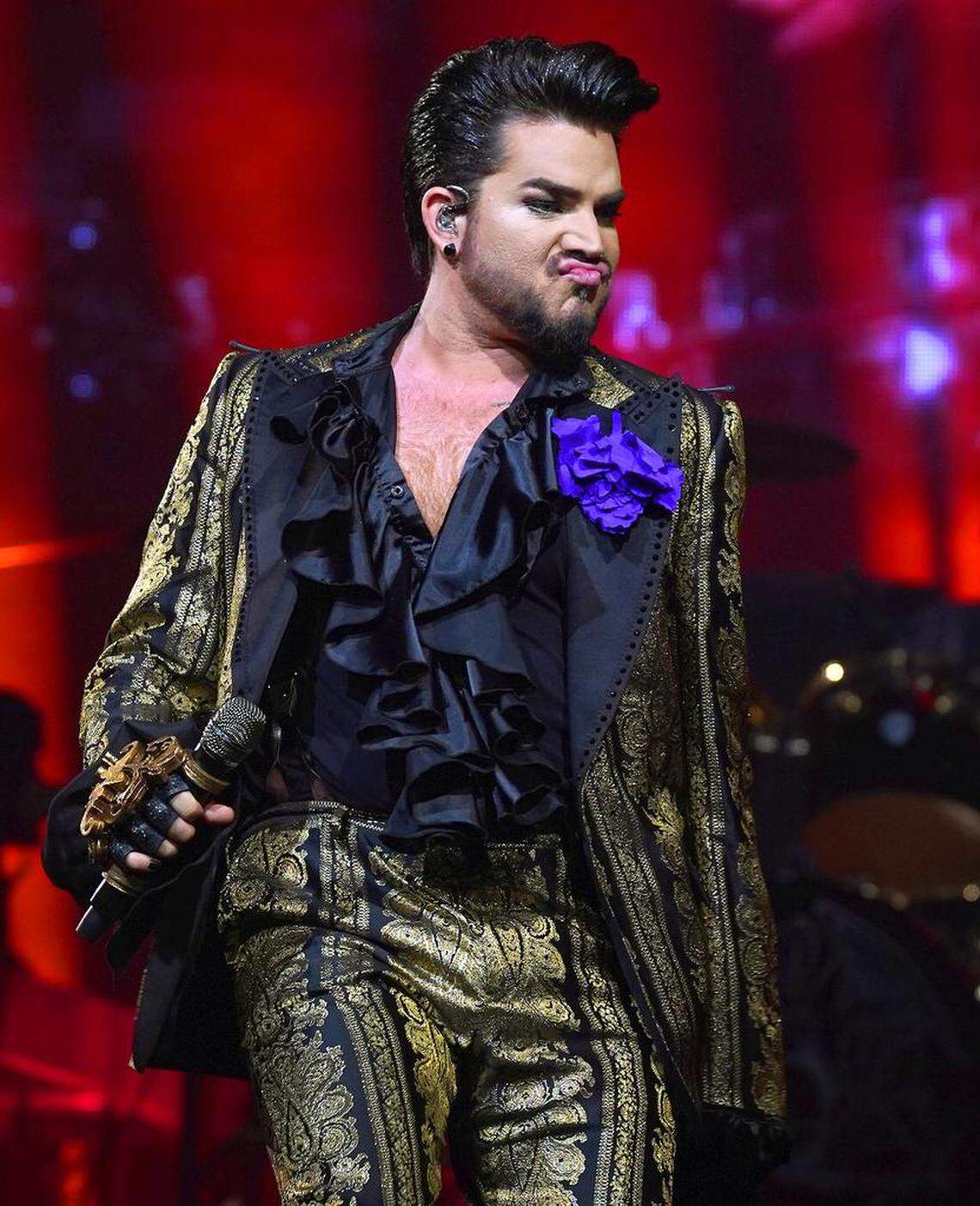 Singer Adam Lambert struts past the audience during the Queen + Adam Lambert show at Spectrum Center in Charlotte, NC on Friday, August 23, 2019.