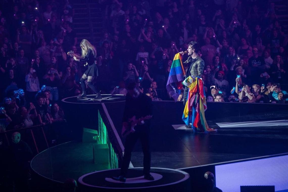 Brendon Urie is draped in flags during his performance of “Girls/Girls/Boys.”