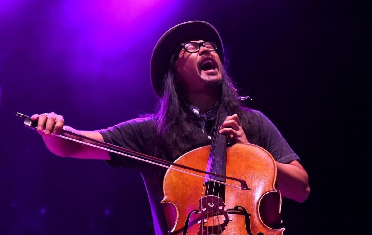 Joe Kwon performs during The Avett Brothers’ set at PNC Music Pavilion on Wednesday night. (Willie Nelson did not allow photographers to shoot his performance.)