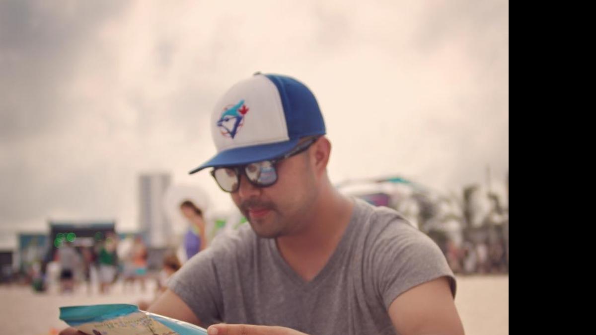
Clture founder Cameron Lee checks out the schedule at HangOut Fest in Alabama earlier this year.
