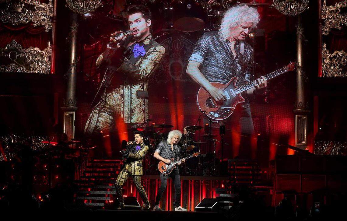 Singer Adam Lambert, left and Queen lead guitarist Brian May, right, perform during the Queen + Adam Lambert show at Spectrum Center in Charlotte, NC on Friday, August 23, 2019.