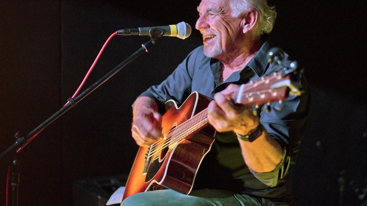 In this Dec. 15 photo, singer/songwriter Jimmy Buffett performs at a cafe in Key West, Fla.