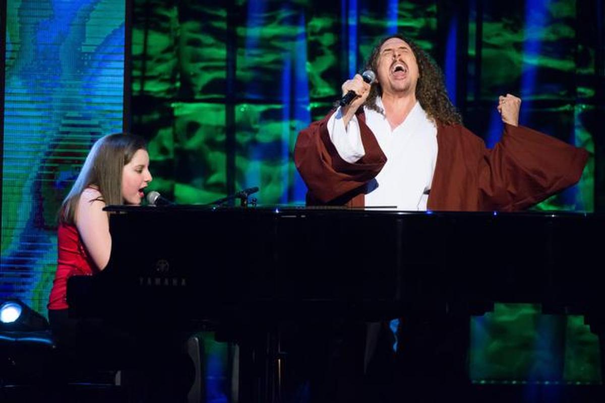 Jodi DiPiazza, left, and Weird Al" Yankovic perform at Comedy Central's "Night of Too Many Stars: America Comes Together for Autism Programs" airing, Sunday 8 p.m.