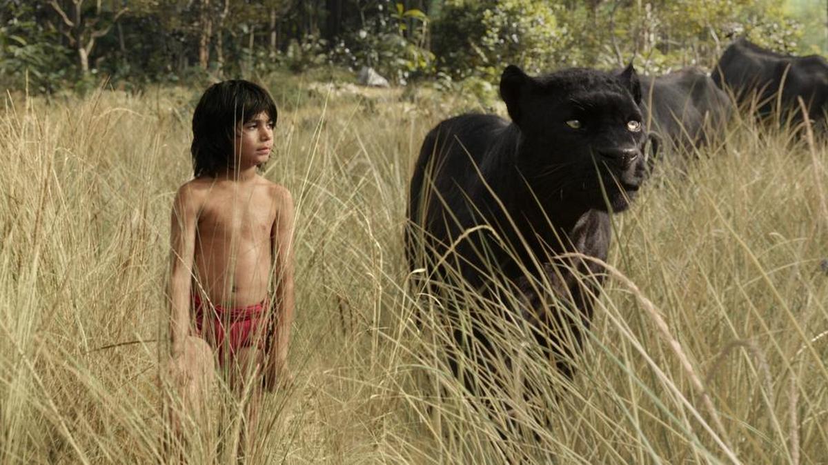 Mowgli (newcomer Neel Sethi) and Bagheera (voice of Ben Kingsley) embark on a captivating journey in “The Jungle Book.”