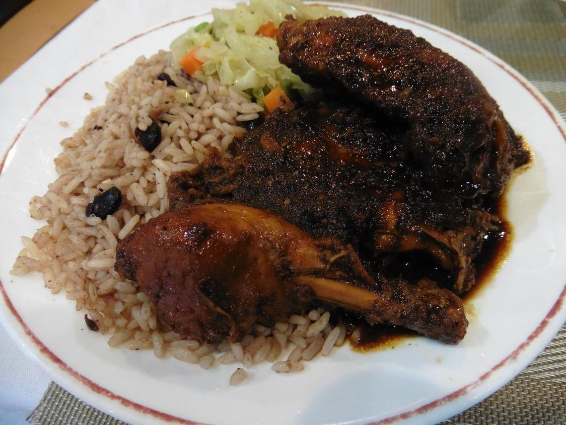 Jerk chicken with rice and beans plus cabbage is served at Mama’s Caribbean.