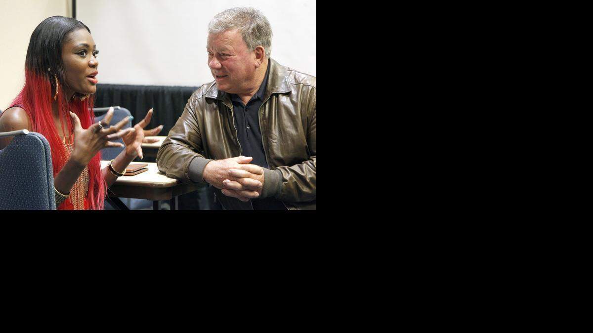 
Contest winner Leona Moore, left, who recently moved to Richmond, Va., from Liberia, chats with actor William Shatner on Friday at the Wizard World Comic Con being held at the Raleigh Convention Center. Moore was Shatner’s two millionth follower on Twitter and won a meet and greet with the star of the original Star Trek. 
