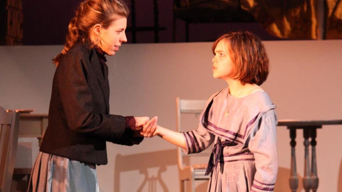 Annie Sullivan (Sarah Woldum) and Helen Keller (Emily Bowers) have a breakthrough in “The Miracle Worker” at Theatre Charlotte.