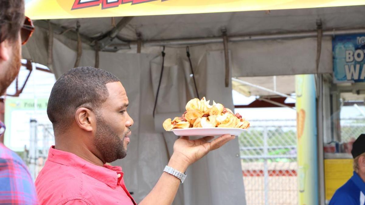 
For his “Carnival Cravings” show, Anthony Anderson samples food at the Got To Be NC Festival in Raleigh. 
