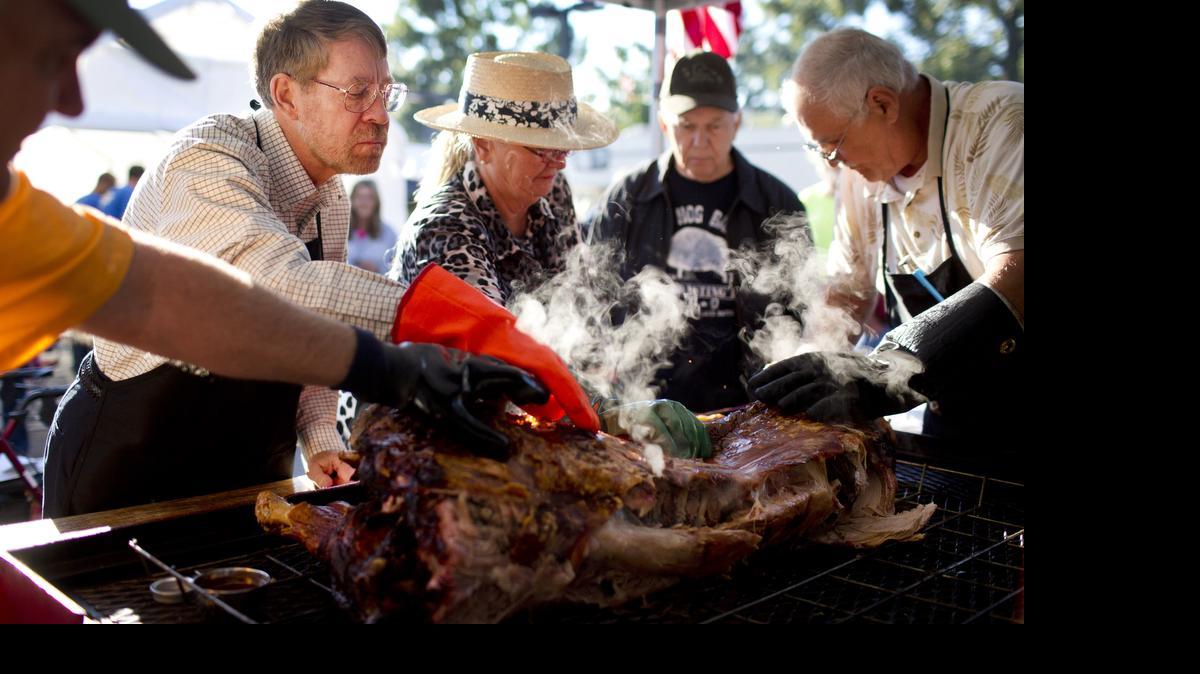 
This is what Carolina-style whole hog barbecue looks like: Judges check the skin on a hog at The N.C. Whole Hog Barbecue State Championship in Raleigh in 2013.


