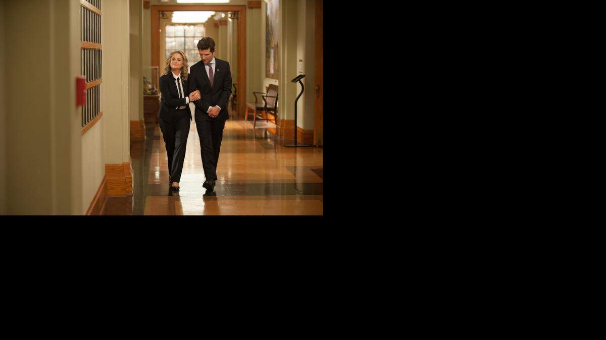 
 Amy Poehler (left) as Leslie Knope and Adam Scott as Ben Wyatt in the series finale of “Parks and Recreation.” 
