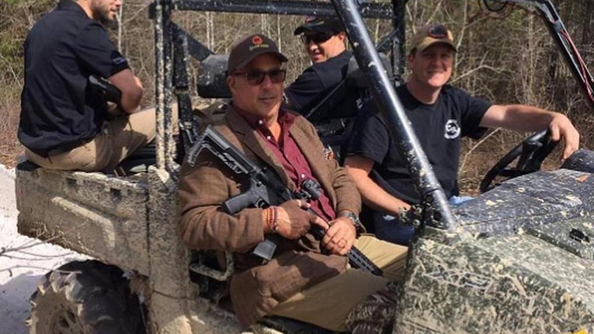 Andrew Zimmern, host of “Bizarre Foods” on the Travel Channel, in passenger seat next to driver Jody Rhodes as they head out to look for Johnston County wild boar.