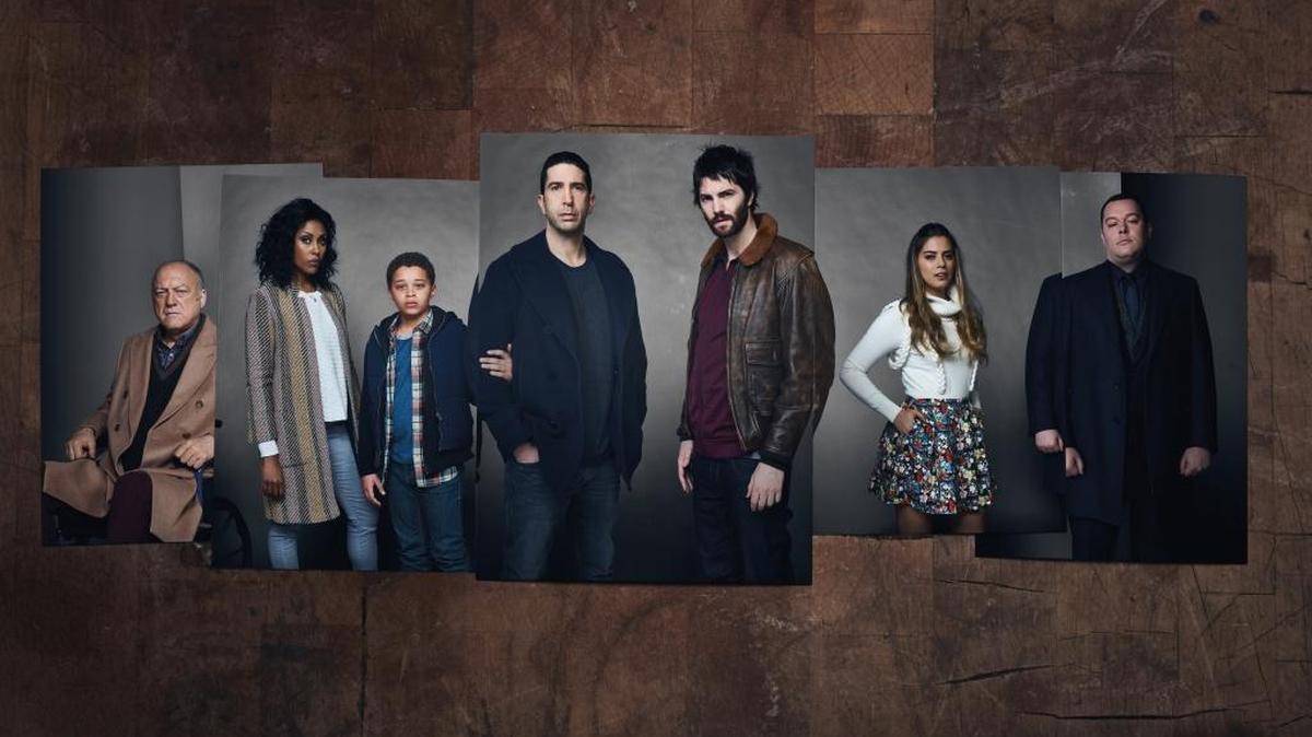 (L-R): John Doman as Aidan Moran, Christine Adams as Rie Moran, Elijah Jacob as TJ Moran, David Schwimmer as Tommy Moran, Jim Sturgess as Dion Patras, Lorenza Izzo as Pilar Herrera and Michael Gladis as Patrick Woichik in AMC’s “Feed the Beast.”