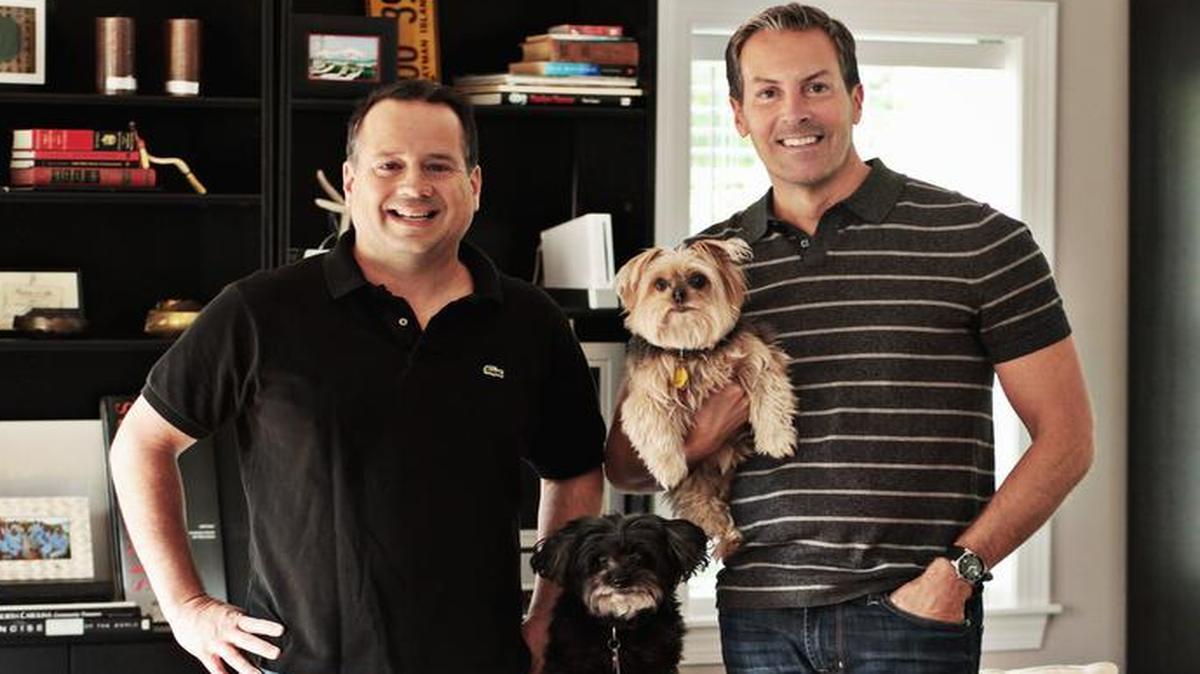 
Homeowners Rodolfo De Martino, left, and Greg Sims with their dogs Sarah and Sissi at their Mordecai home.

