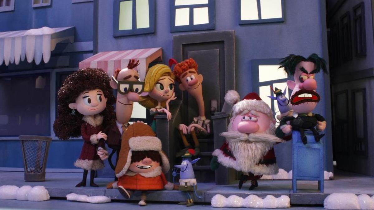 (L-R): Emily Hobbs, Walter Hobbs, Michael Hobbs, Jovie, Buddy, Santa and Mr. Greenway in “Elf: Buddy’s Musical Christmas.”