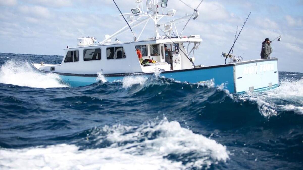 Captain TJ Ott (right), First Mate Jarrett Przybyszewsk (middle) and Deckhand Mike Ott (left) experience rough waters aboard the Hot Tuna off North Carolina’s Outer Banks.