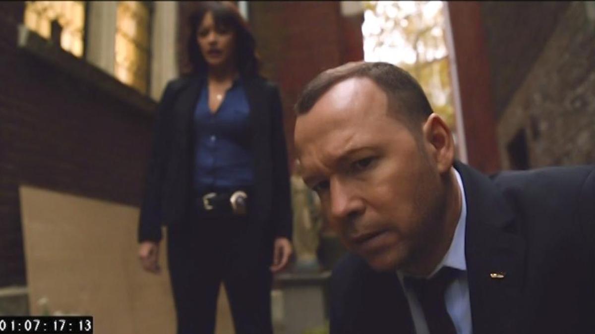 Donnie Wahlberg (foreground) as Danny Reagan and Marisa Ramirez as Det. Maria Baez in “Blue Bloods.”