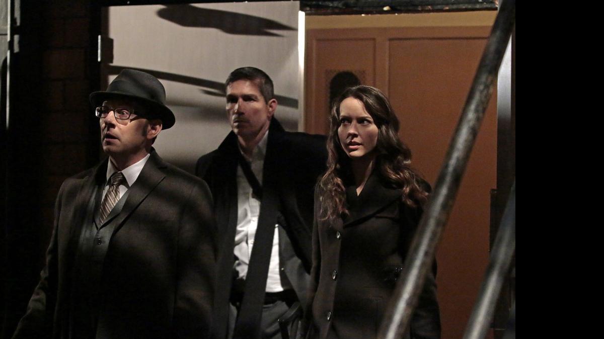 
Finch (Michael Emerson, left) and Root (Amy Acker, right) race to save The Machine, while Reese (Jim Caviezel, center) is caught in the middle of the final showdown between rival crime bosses Elias and Dominic, on the fourth season finale of “Person of Interest.” 
