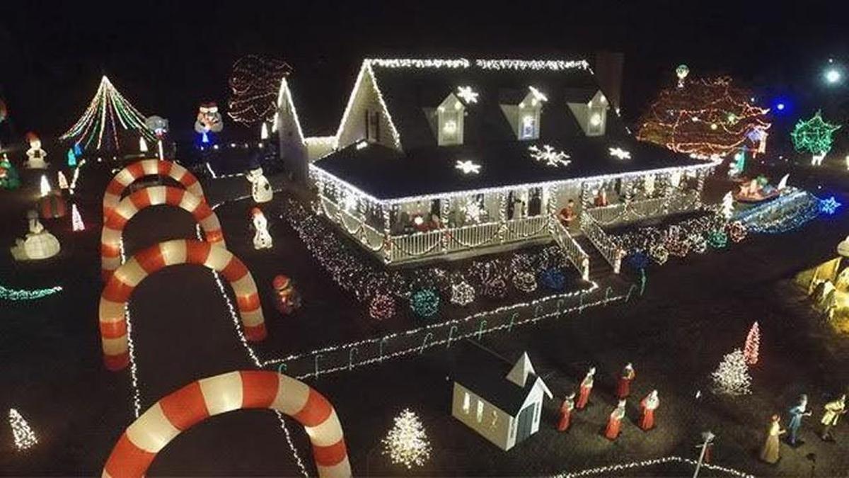 The Moore family of Raleigh shows off their eclectic array of decorations at Happyland Christmas Lights in “The Great Christmas Light Fight” TV show on ABC.