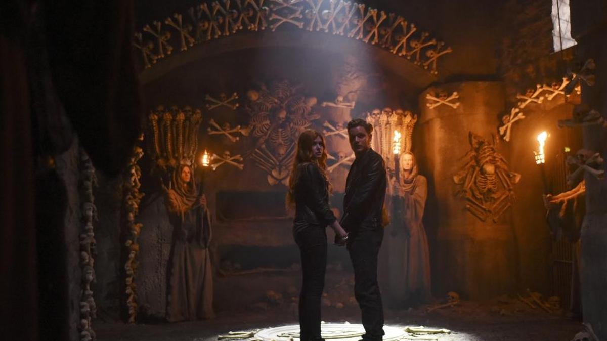 Katherine McNamara and Dominic Sherwood in ABC Family’s “Shadowhunters.”