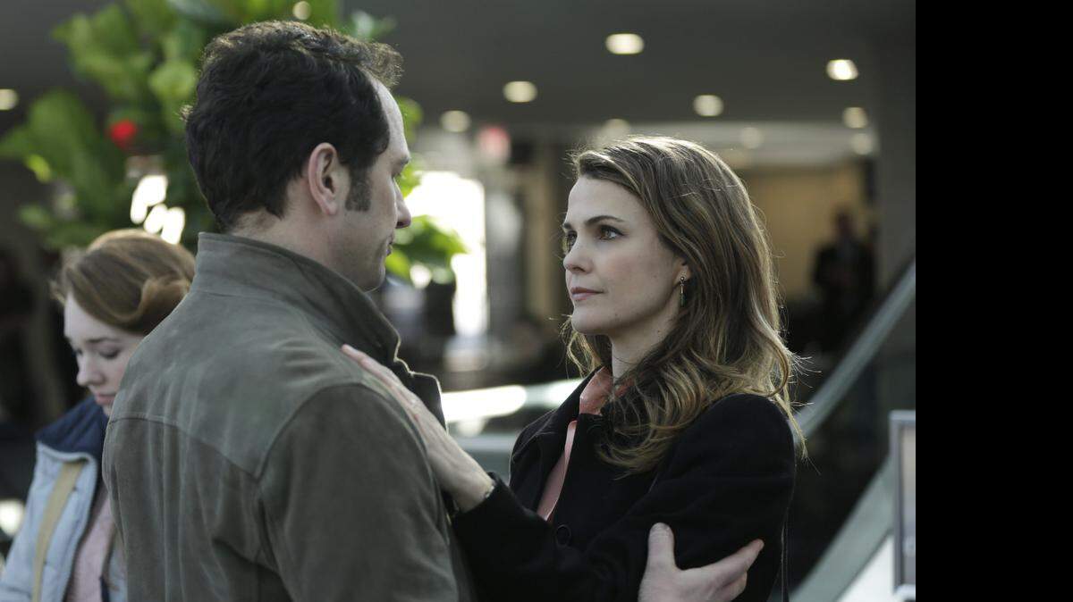 
 Matthew Rhys (left) as Philip Jennings and Keri Russell as Elizabeth Jennings in the Season 3 finale of “The Americans.” 
