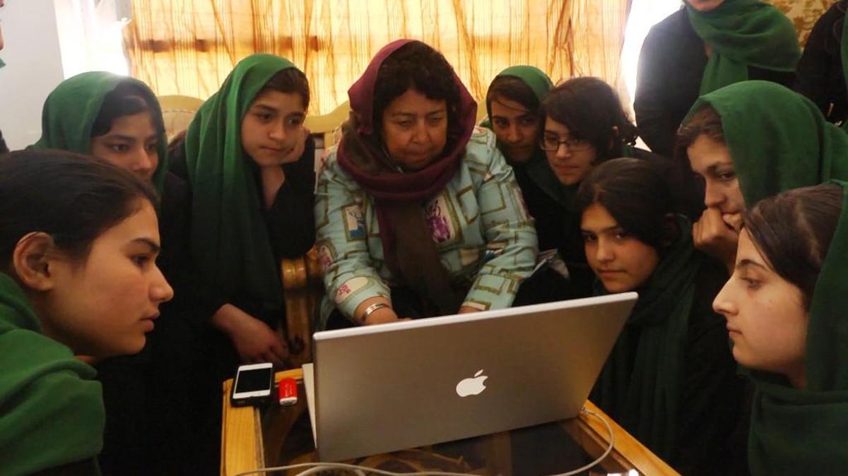 Razia shows her “CNN Hero” video to the graduating class of the Zabuli Education Center in the POV documentary “What Tomorrow Brings.”