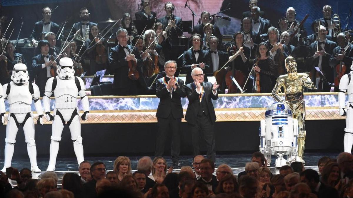 (L-R): Storm Troopers, Steven Spielberg, Martin Scorsese, R2D2 and C3PO salute George Lucas at “The 38th Annual Kennedy Center Honors.”