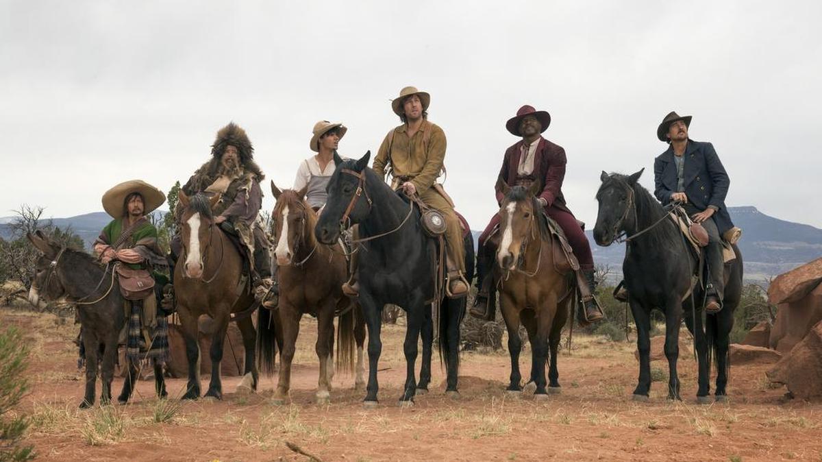 'The Ridiculous Six' stars (left to right) Rob Schneider, Jorge Garcia, Taylor Lautner, Adam Sandler, Terry Crews, and Luke Wilson. Photo credit: