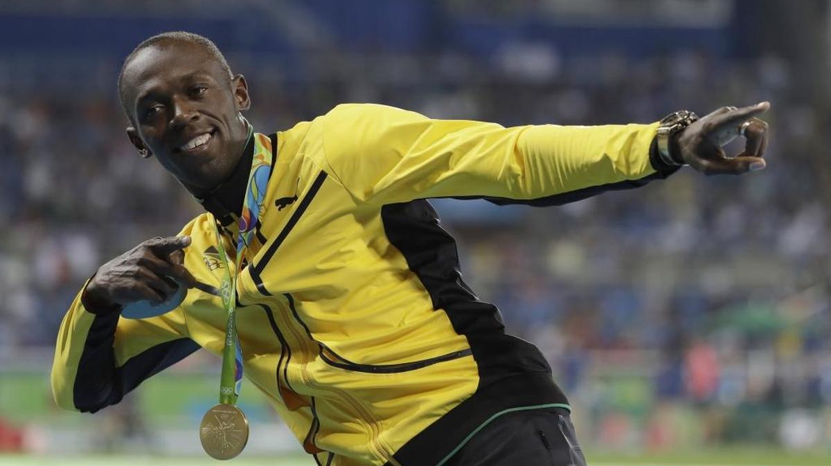 Jamaica's Usain Bolt celebrates with the gold medal after winning the men's 100-meter final during the athletics competitions of the 2016 Summer Olympics at the Olympic stadium in Rio de Janeiro, Brazil, Monday, Aug. 15, 2016.