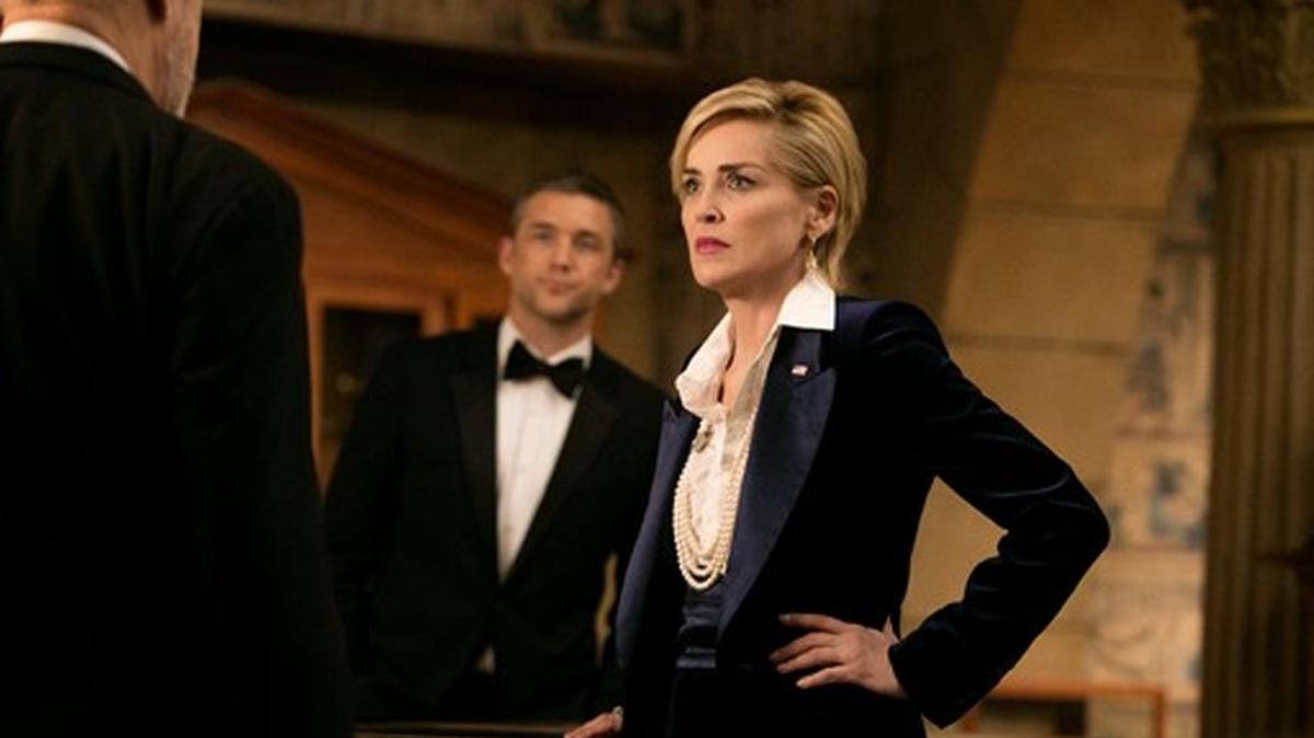 Jeff Hephner (background) is a secret agent who works for the vice president, played by Sharon Stone.