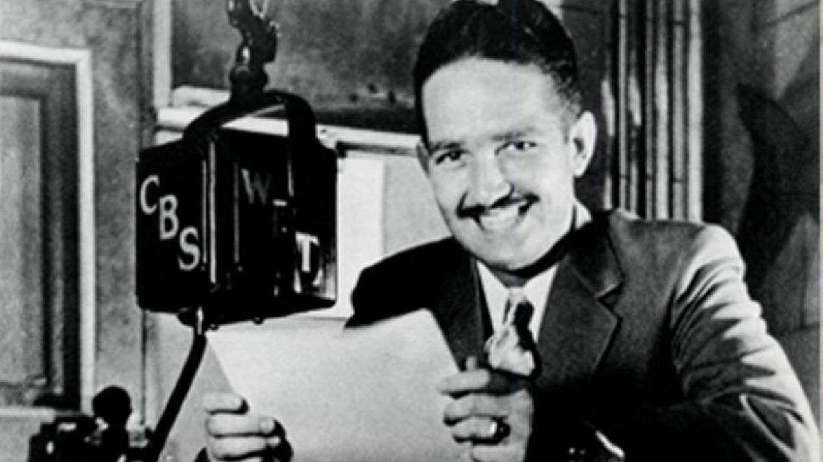 Charles Crutchfield before the microphone at WBT Radio.