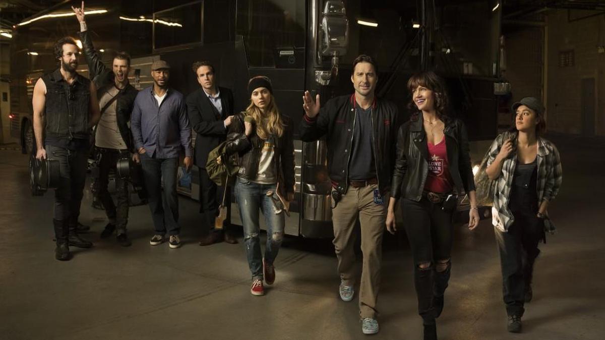 (L-R): Peter Cambor as Milo, Colson Baker as Wes, Finesse Mitchell as Harvey, Rafe Spall as Reg, Imogen Poots as Kelly Ann, Luke Wilson as Bill Hanson, Carla Gugino as Shelli Anderson and Keisha Castle-Hughes as Donna in “Roadies” on Showtime.