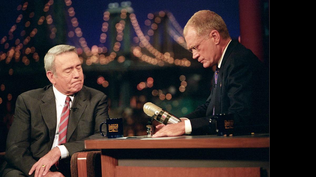 
Dan Rather, of the CBS Evening News, is comforted by David Letterman during a break after Rather was overcome by emotion while discussing the tragedies of 9/11 on “The Late Show with David Letterman,” September 17, 2001. 
